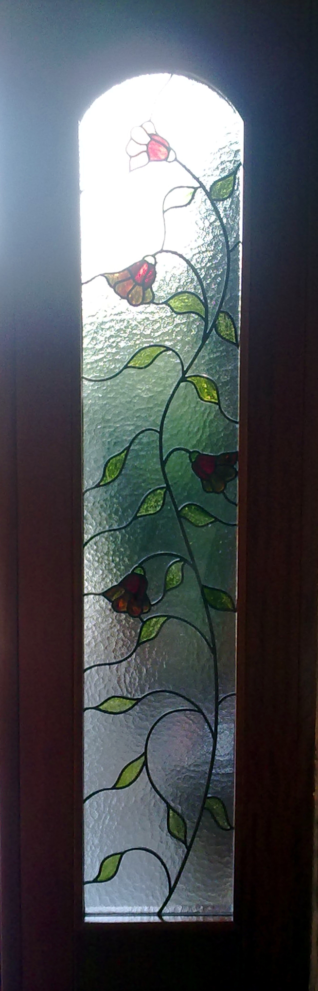 Vidriera floral en obra